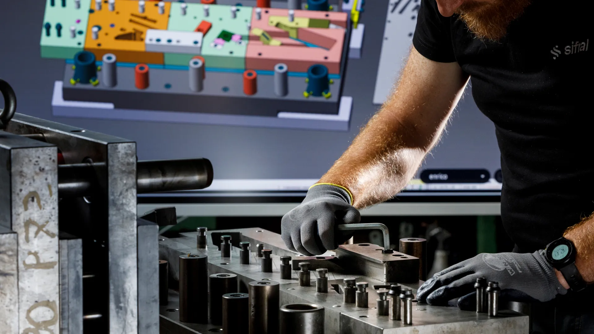 Sifral toolmaker assembling a sheet metal stamping die in the in-house toolroom